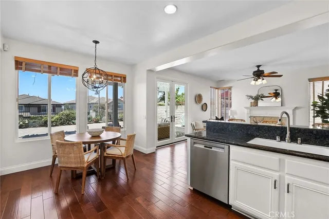 a bedroom with a large bed and a potted plant