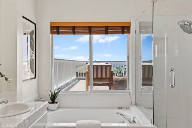 a view of a house with a yard and balcony