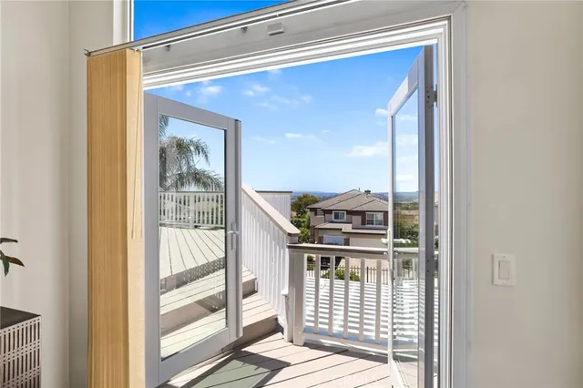 a living room with furniture a window and a potted plant