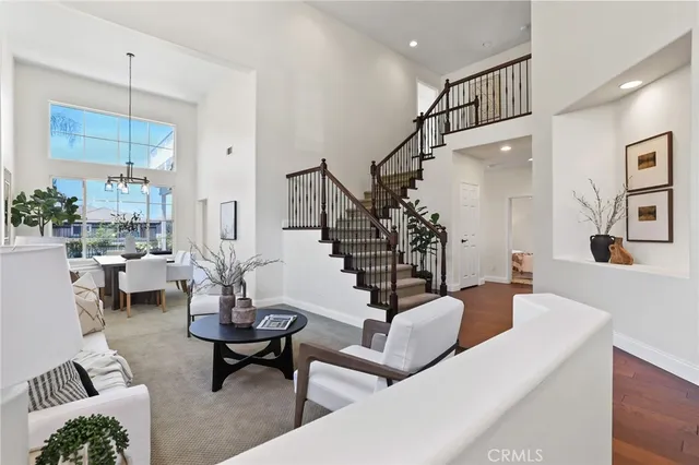 a living room with furniture or stairs and a wooden floor
