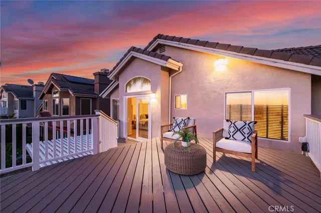 a front view of a house with a garden and plants