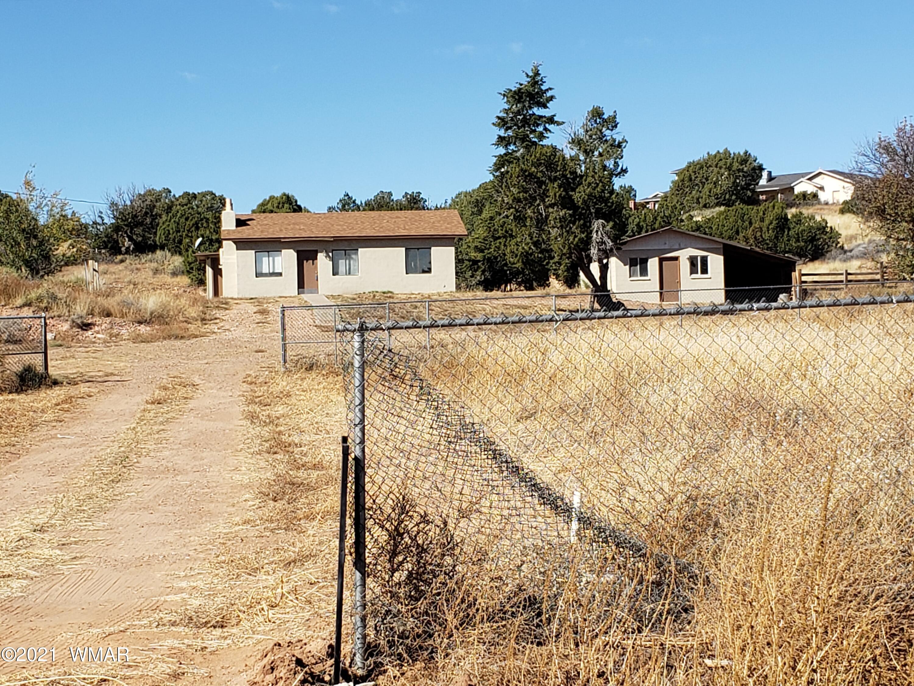 2656 Paper Mill Road Taylor, AZ 85939 - Photo 14 of 14 a front view of a house with a yard