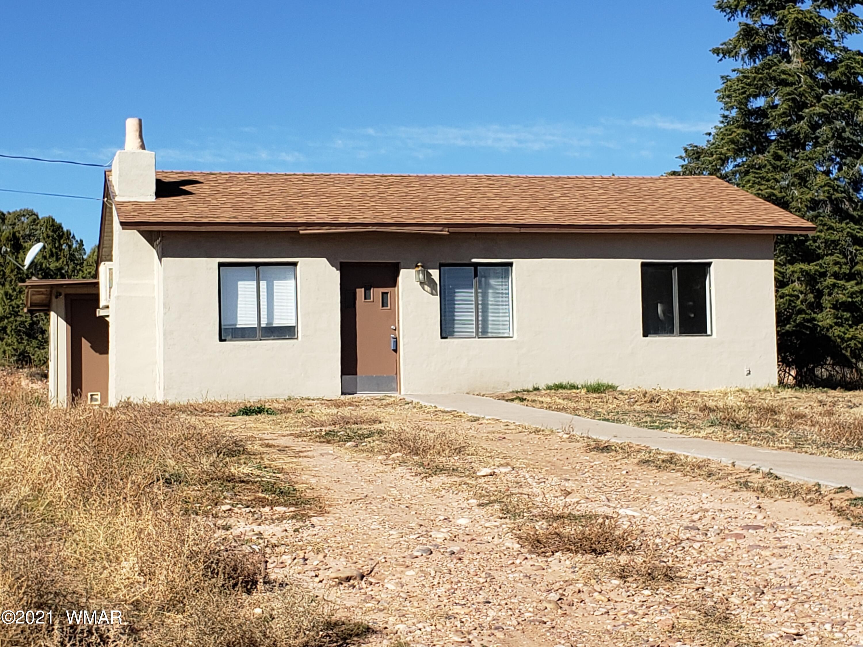 2656 Paper Mill Road Taylor, AZ 85939 - Photo 2 of 14 a view of a house with a yard