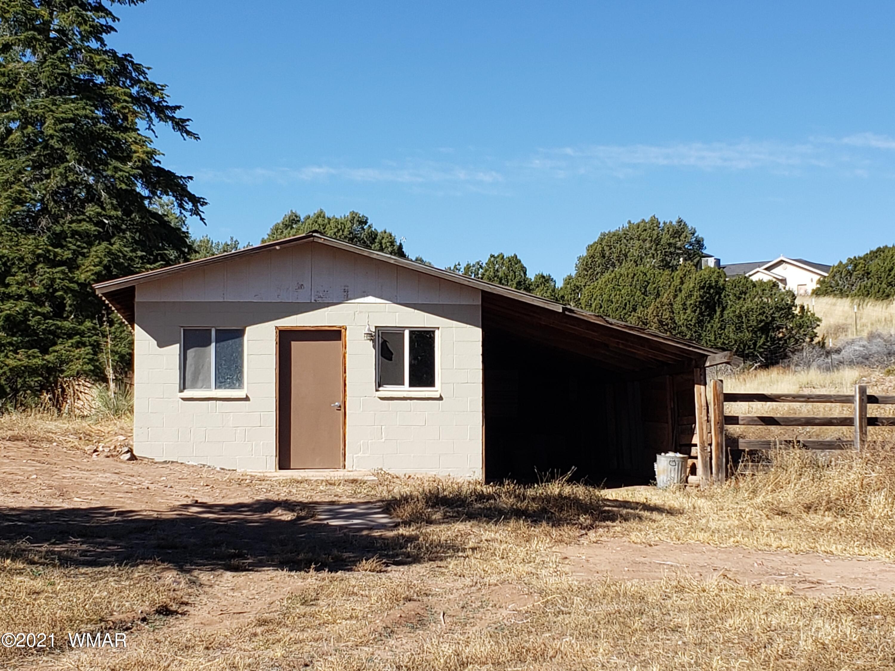 2656 Paper Mill Road Taylor, AZ 85939 - Photo 3 of 14 a front view of a house with a yard