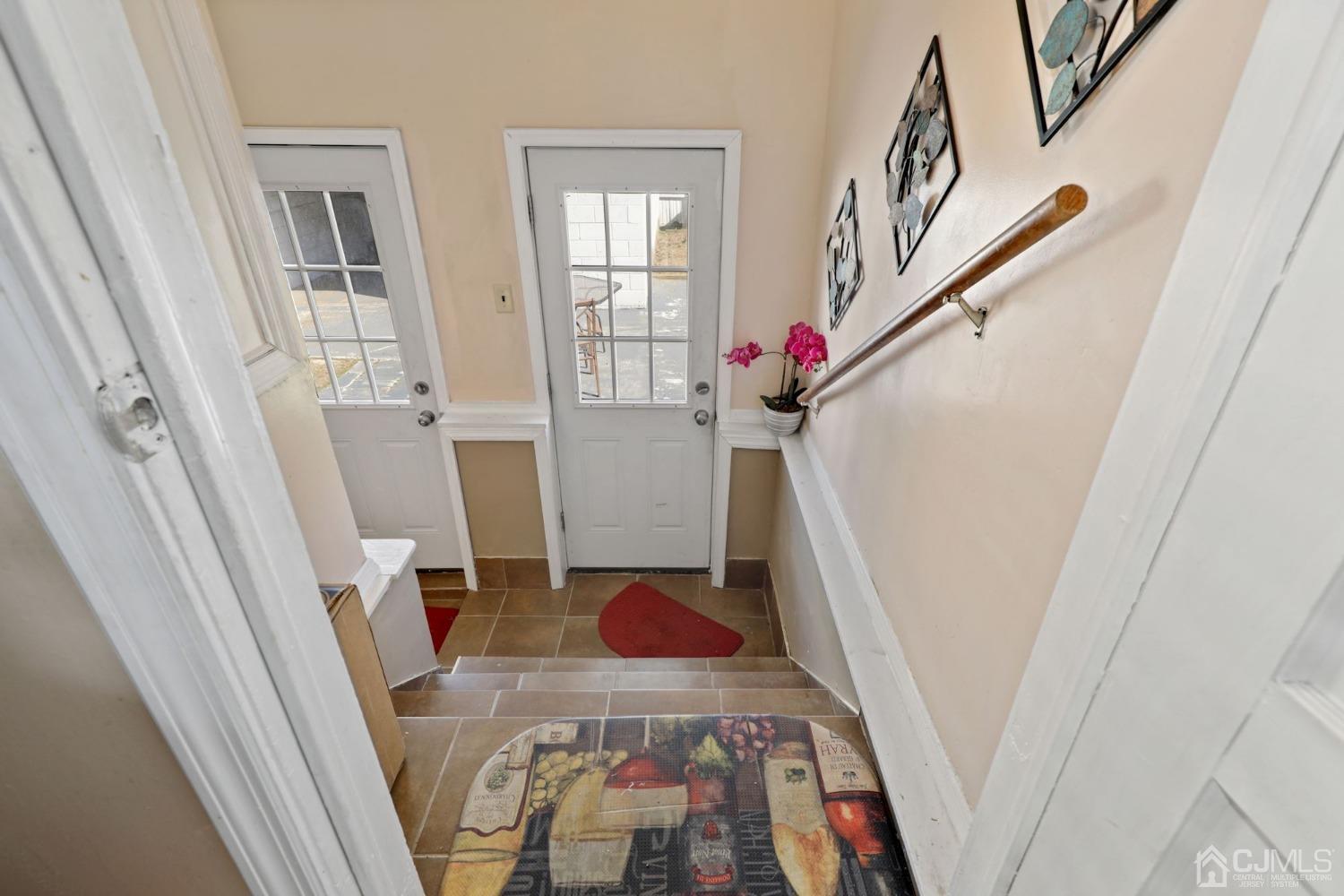 53 Helmetta Road Monroe Township, NJ 08831 - Photo 13 of 30 a view of entryway and hallway with wooden floor
