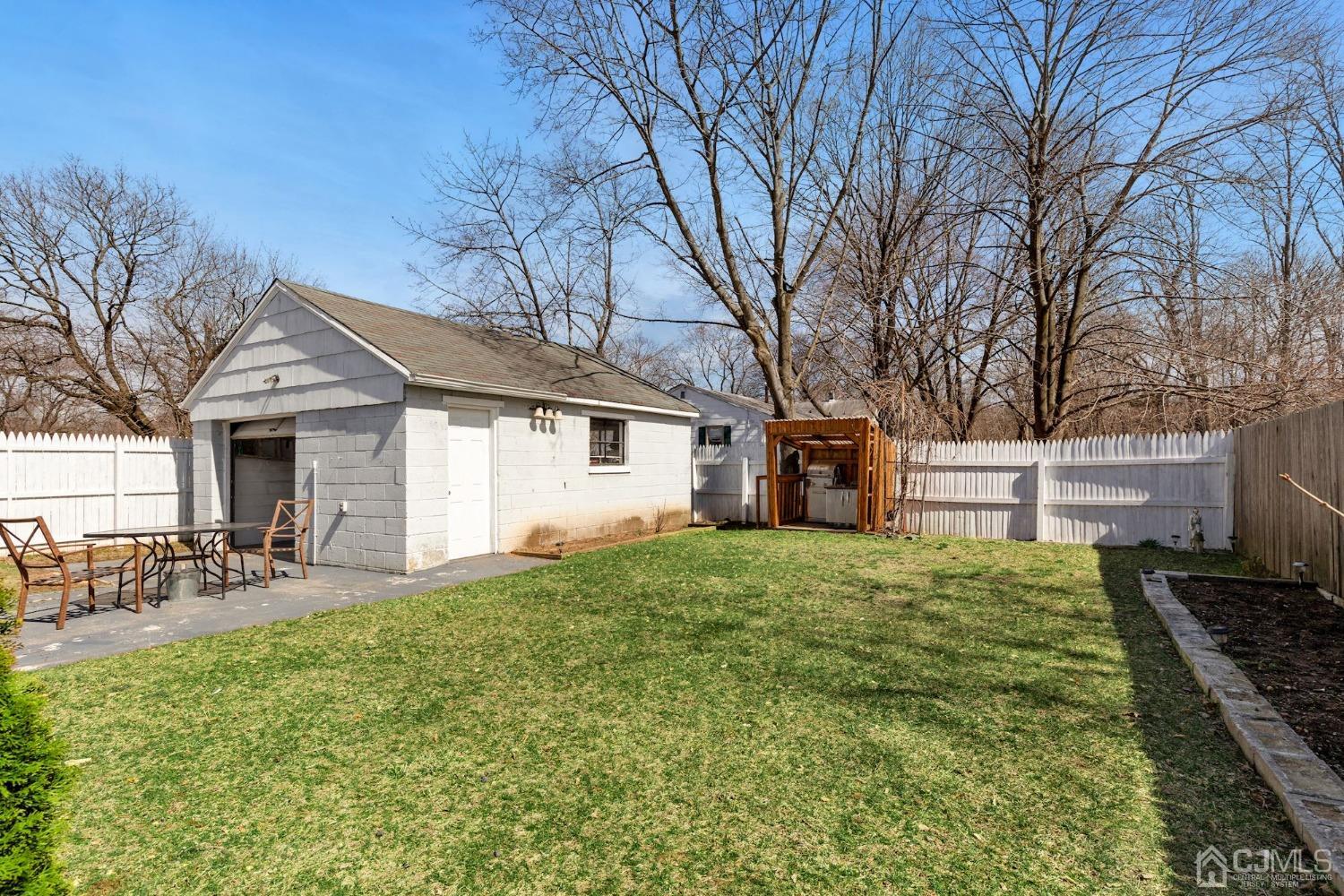 53 Helmetta Road Monroe Township, NJ 08831 - Photo 27 of 30 a house view with a sitting space and garden