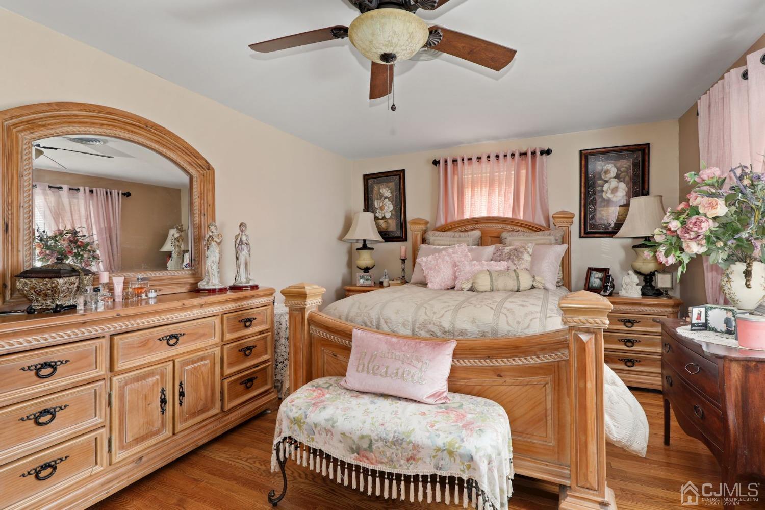 53 Helmetta Road Monroe Township, NJ 08831 - Photo 10 of 30 a spacious bedroom with a bed a dresser and potted plants on the table