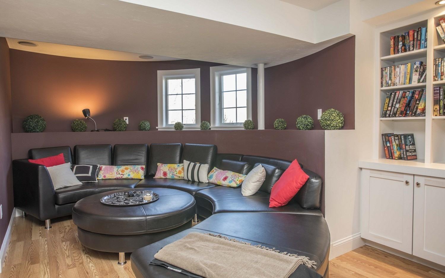 68 Shoestring Bay Road Mashpee, MA 02649 - Photo 20 of 30 a living room with furniture and a book shelf