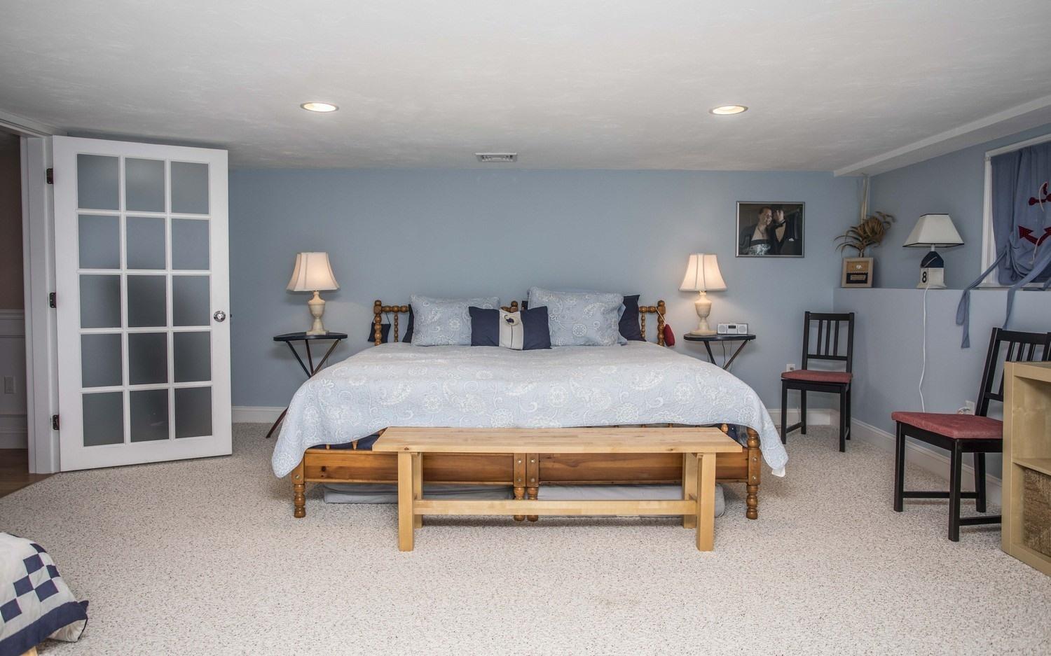 68 Shoestring Bay Road Mashpee, MA 02649 - Photo 23 of 30 a bed room with a bed and a chair
