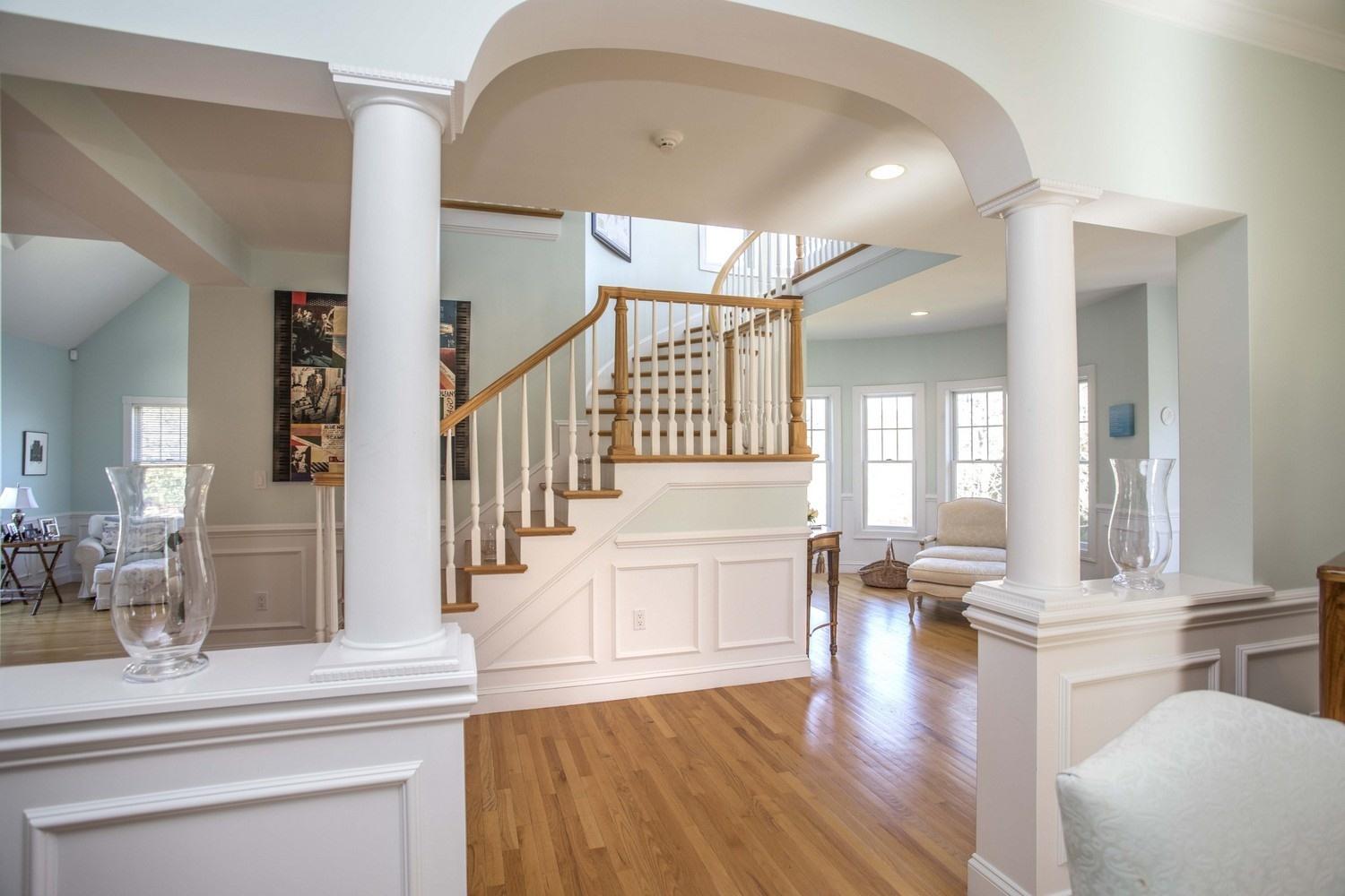 68 Shoestring Bay Road Mashpee, MA 02649 - Photo 3 of 30 a living room with fireplace furniture and a wooden floor
