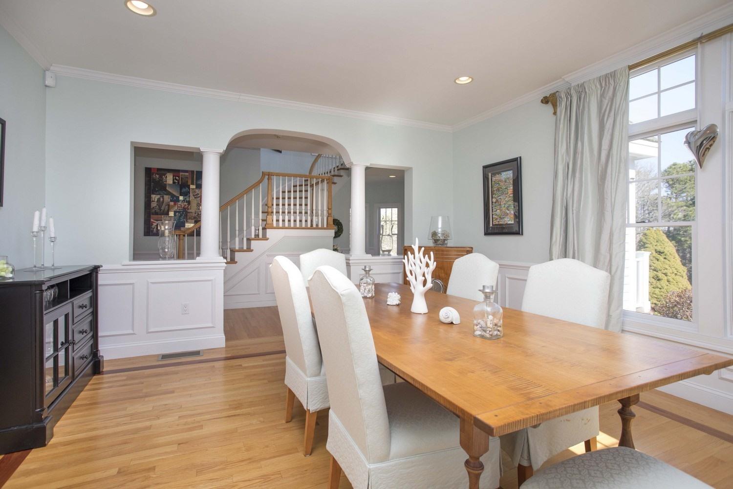 68 Shoestring Bay Road Mashpee, MA 02649 - Photo 4 of 30 a view of a dining room with furniture window and wooden floor