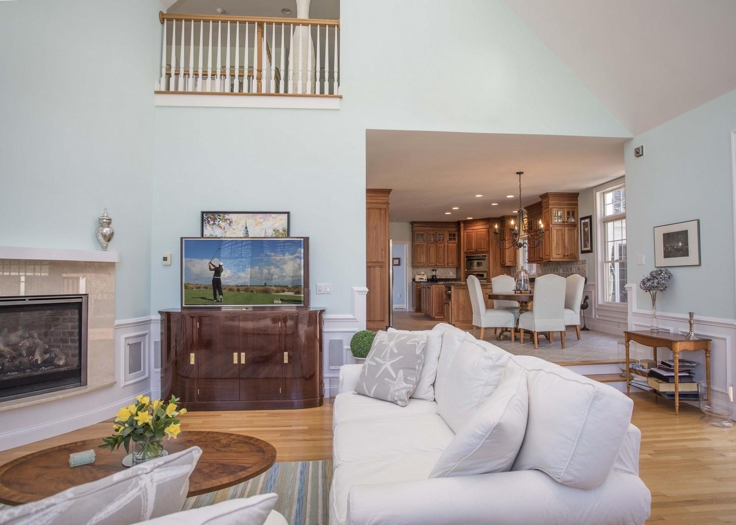 68 Shoestring Bay Road Mashpee, MA 02649 - Photo 9 of 30 a living room with furniture and a fireplace