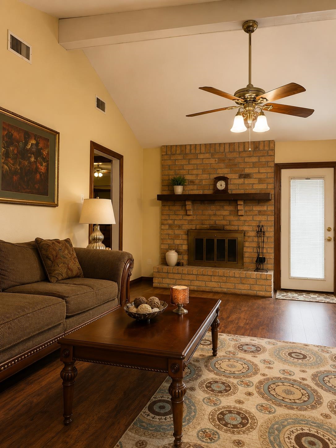 5845 Meadowview Road Beaumont, TX 77708 - Photo 11 of 24 a living room with furniture a dining table and a fireplace