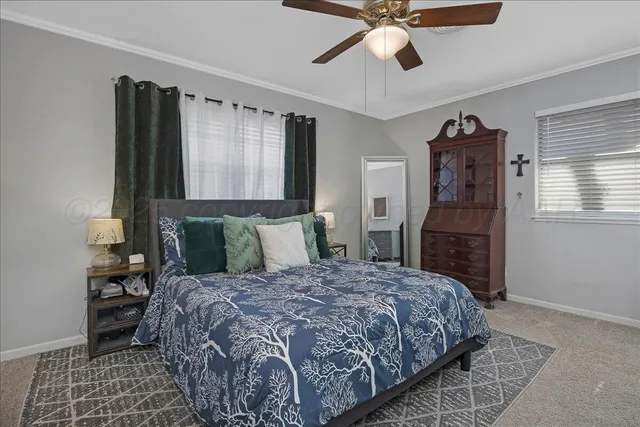 a bedroom with a bed dresser and a window