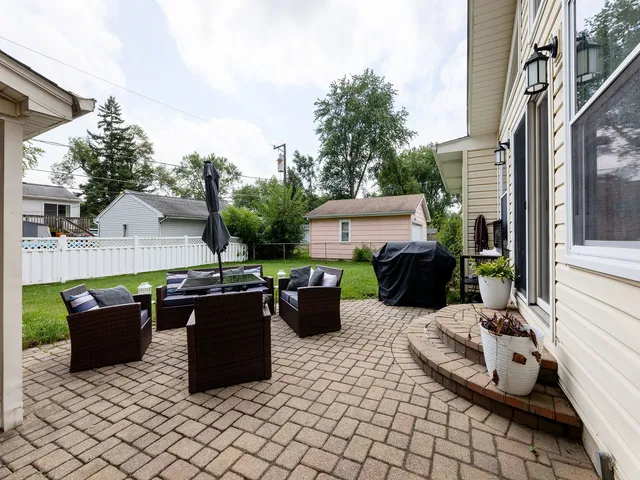 a view of a patio with chairs and tables