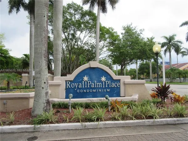 a view of a park with slide and potted plants