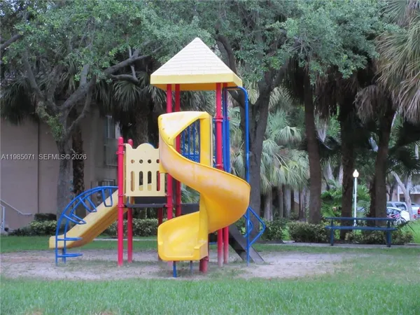 a bedroom with a bed and a plant