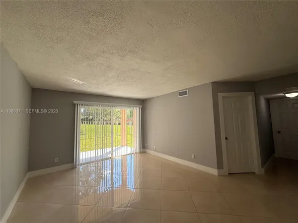 a view of an empty room and window
