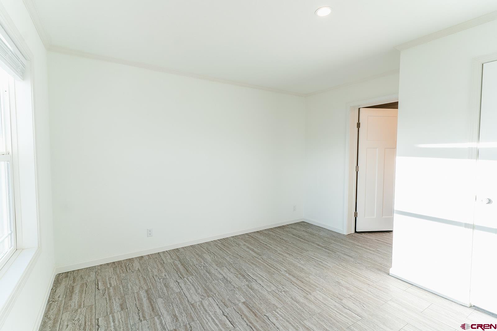 62650 Lasalle Road, Unit 343 Montrose, CO 81403 - Photo 14 of 24 an empty room with wooden floor