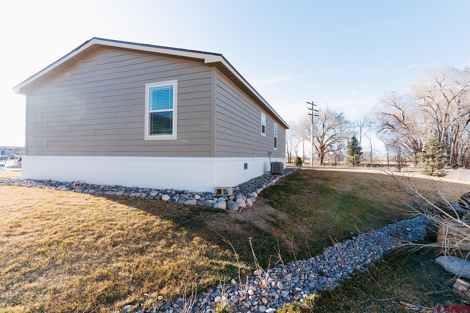 62650 Lasalle Road, Unit 343 Montrose, CO 81403 - Photo 2 of 24 a view of a backyard of the house