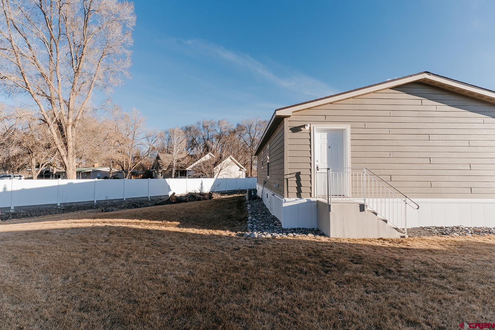 62650 Lasalle Road, Unit 343 Montrose, CO 81403 - Photo 3 of 24 a view of a house with a yard