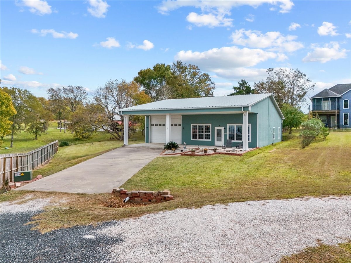 a view of a house with a swimming pool and a yard
