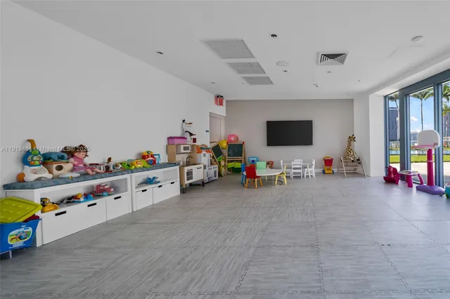 a room with toys and dresser