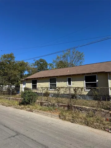 a view of two chairs in the patio