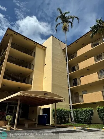 a front view of a house with plants