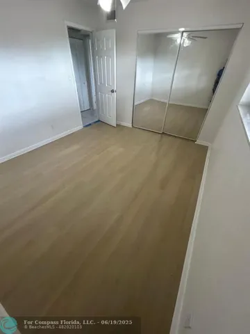 an empty room with fan