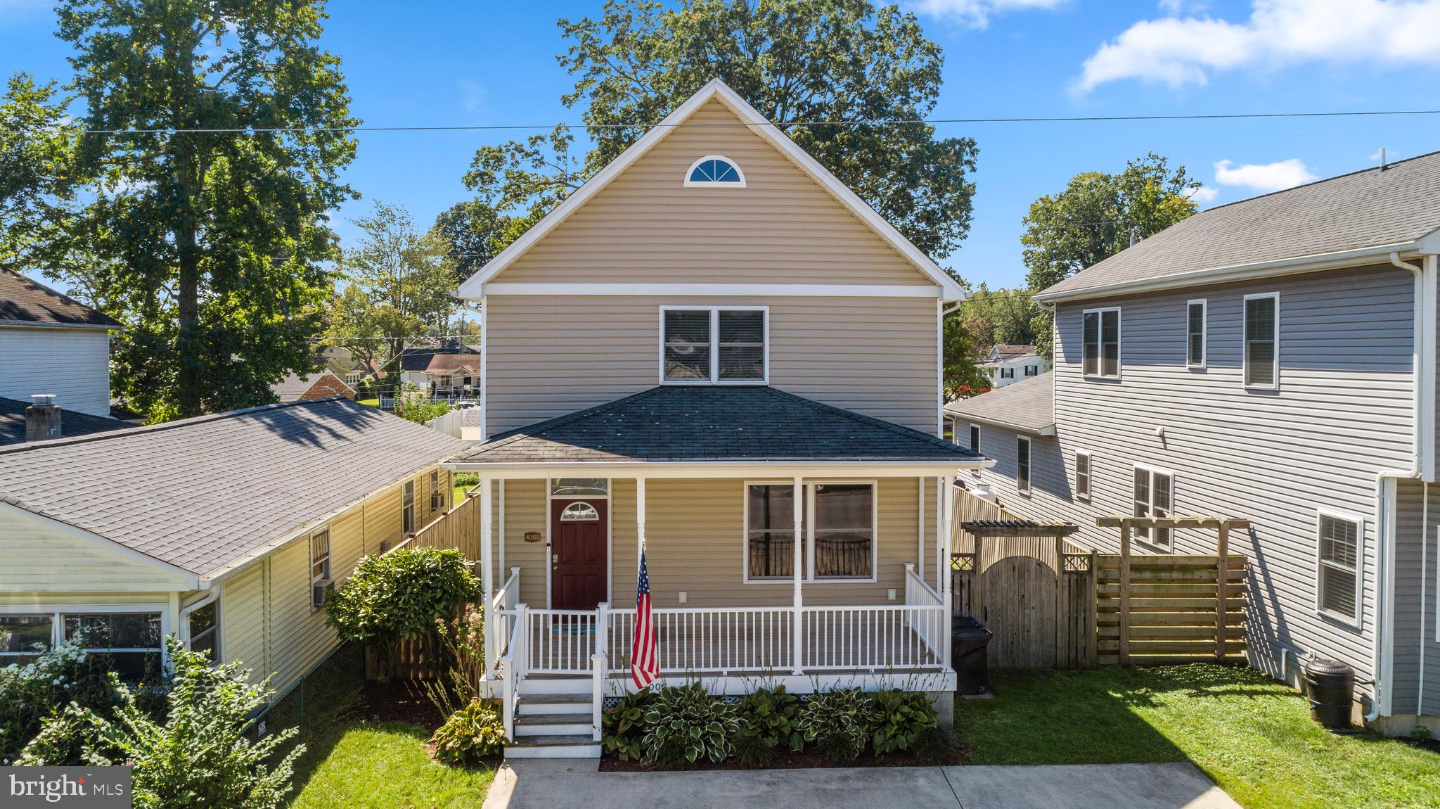 4005 7th Street North Beach, MD 20714 - Photo 1 of 47 a front view of a house with a yard