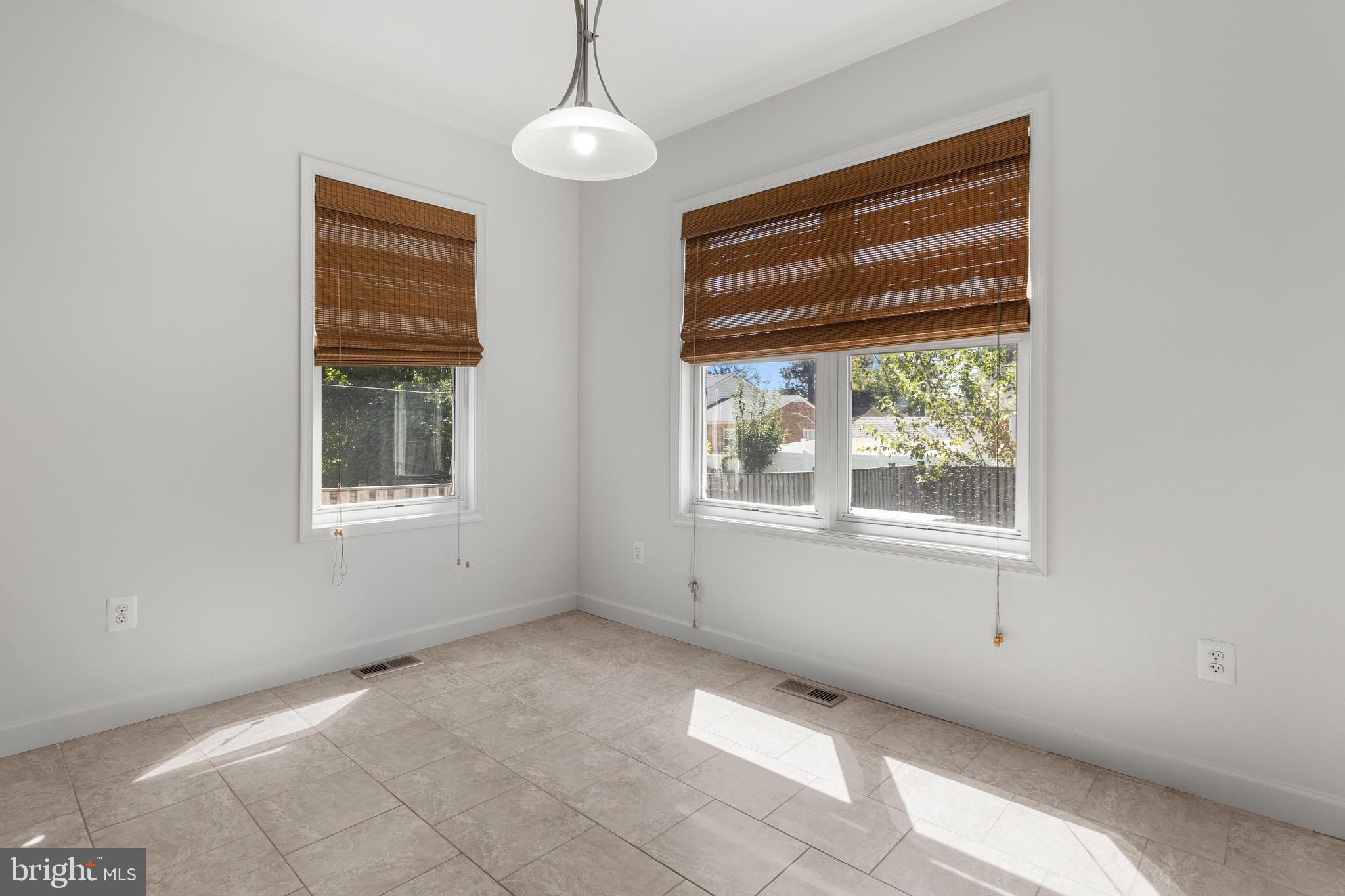 4005 7th Street North Beach, MD 20714 - Photo 14 of 47 a view of empty room with windows