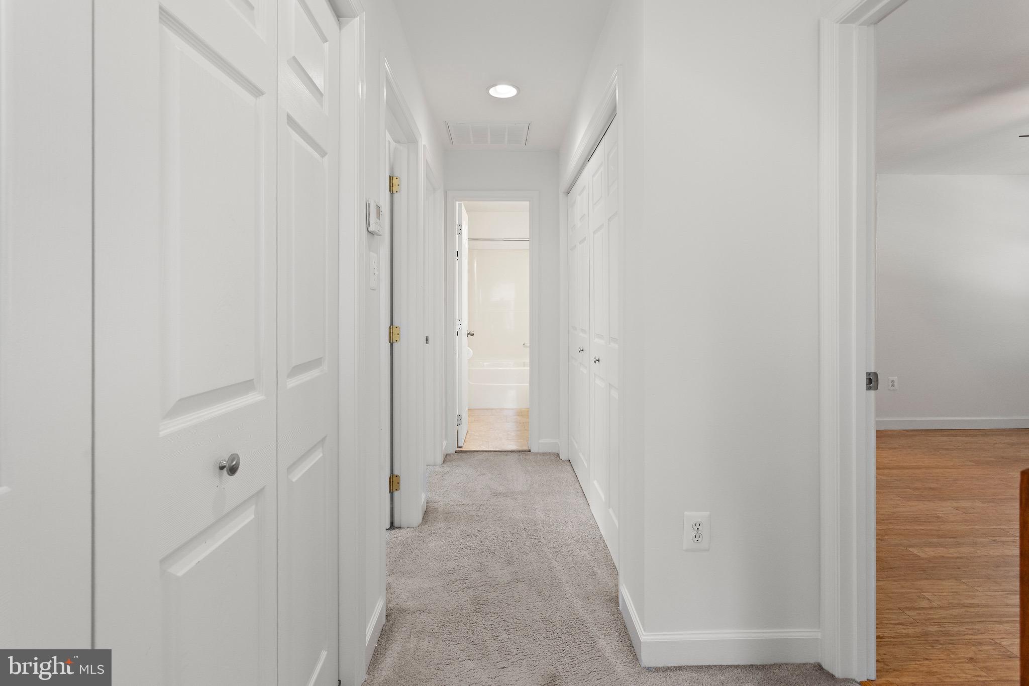 4005 7th Street North Beach, MD 20714 - Photo 29 of 47 a view of a hallway with wooden shelves