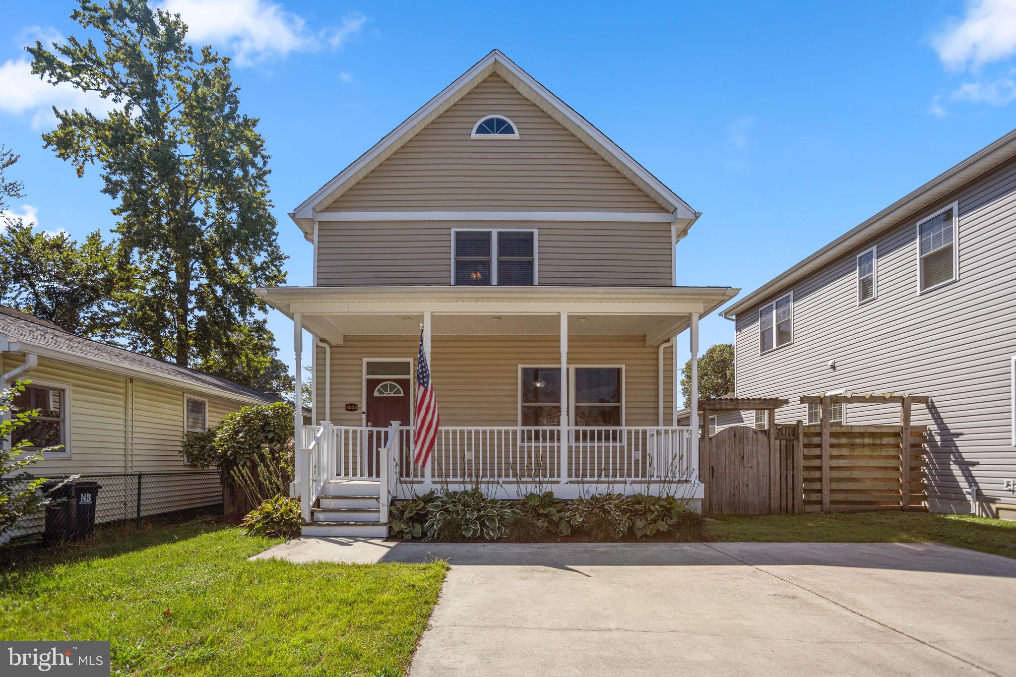 4005 7th Street North Beach, MD 20714 - Photo 3 of 47 a front view of a house with a yard