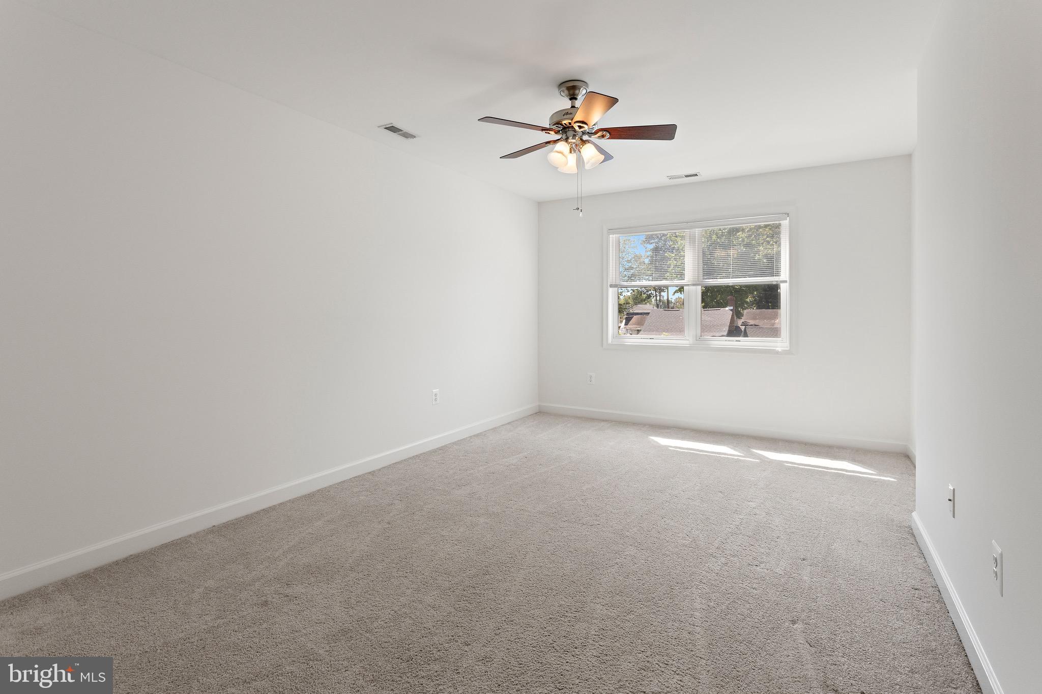 4005 7th Street North Beach, MD 20714 - Photo 31 of 47 a view of an empty room with a window