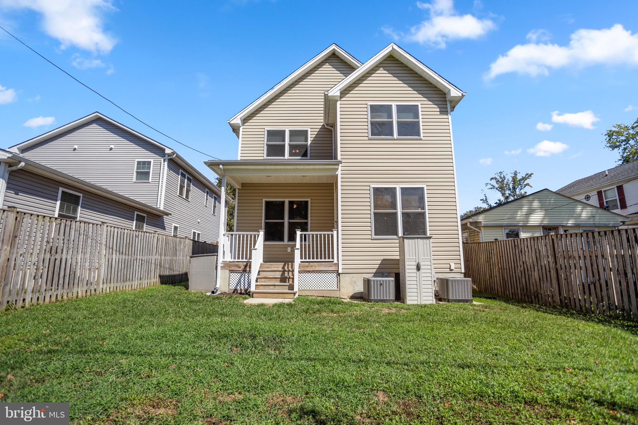4005 7th Street North Beach, MD 20714 - Photo 36 of 47 a front view of a house with garden