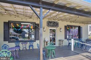 4005 7th Street North Beach, MD 20714 - Photo 44 of 47 a front view of a building with outdoor seating
