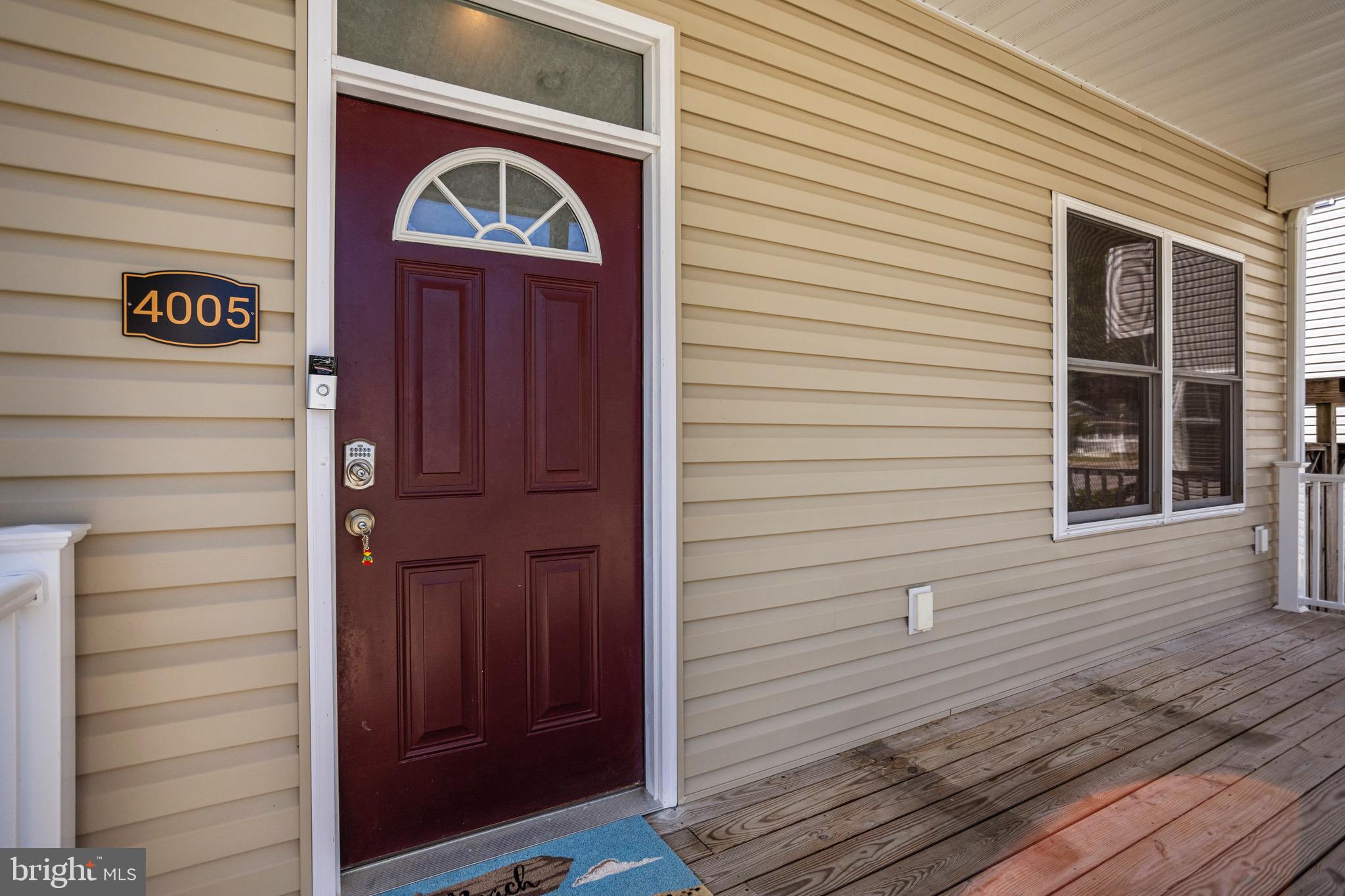 4005 7th Street North Beach, MD 20714 - Photo 5 of 47 a front view of a house with a door