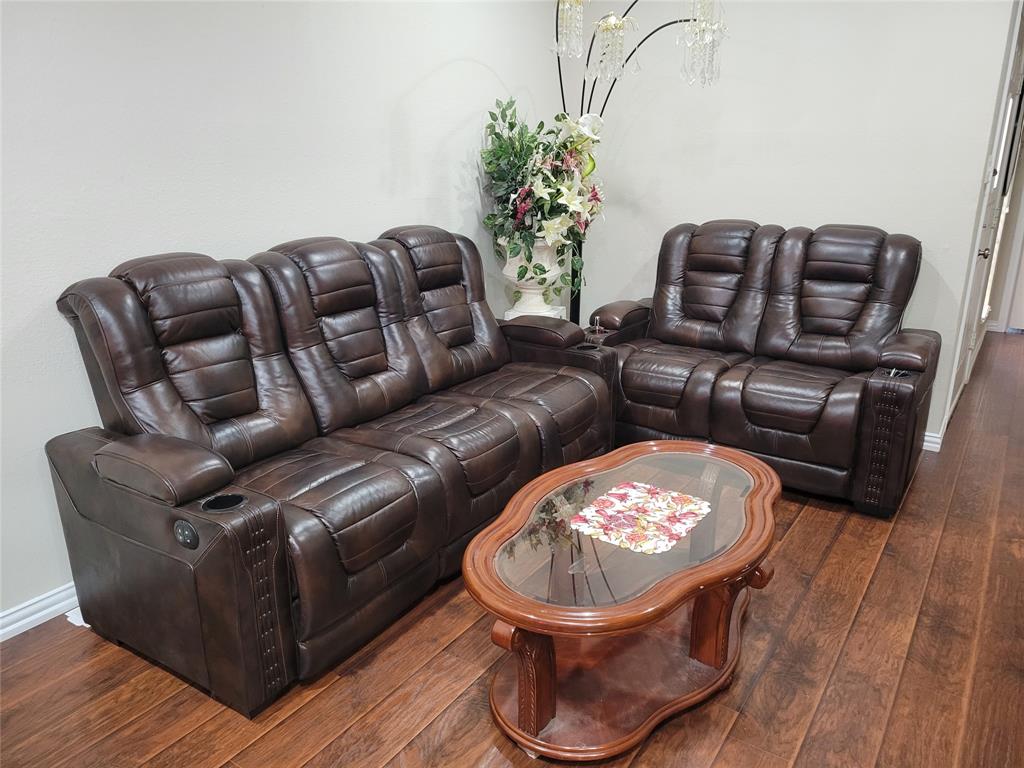 5565 Preston Oaks Road, Unit 117 Dallas, TX 75254 - Photo 2 of 24 a living room with furniture a couch and a potted plant