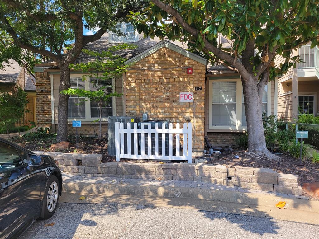 5565 Preston Oaks Road, Unit 117 Dallas, TX 75254 - Photo 4 of 24 a view of a house with a yard