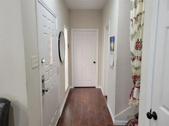 a view of a bathroom from a hallway