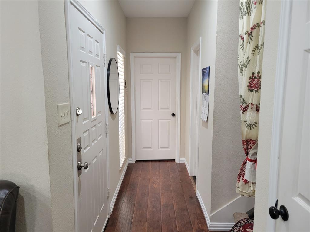 5565 Preston Oaks Road, Unit 117 Dallas, TX 75254 - Photo 7 of 24 a view of a bathroom from a hallway