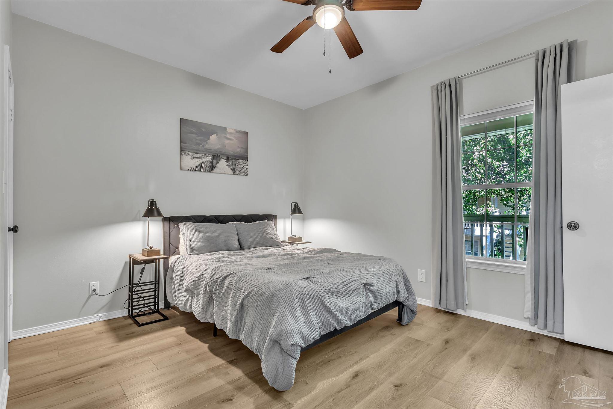 501 East Burgess Road, Unit F5 Pensacola, FL 32504 - Photo 12 of 12 a bedroom with a large bed and a window