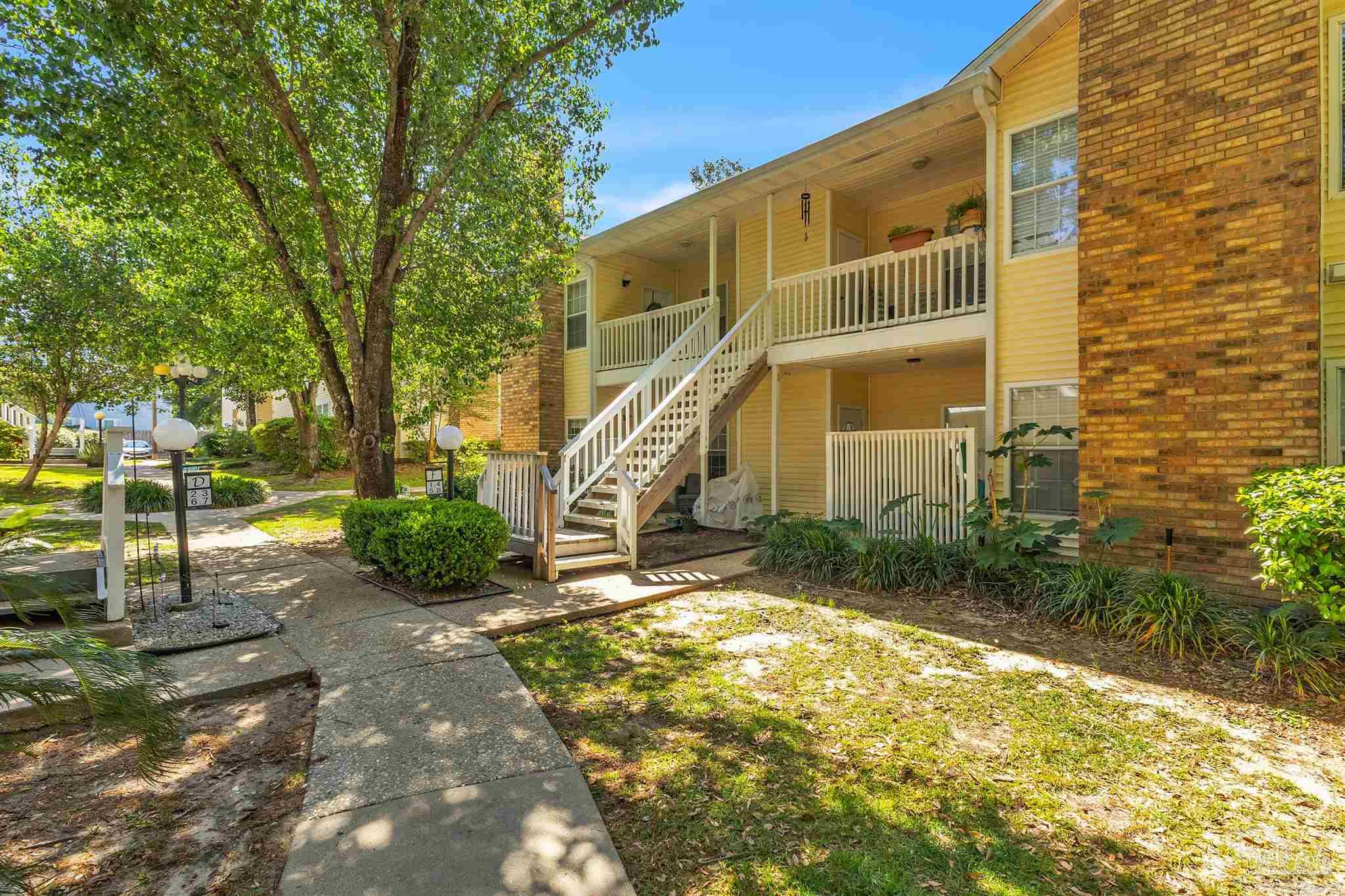 501 East Burgess Road, Unit F5 Pensacola, FL 32504 - Photo 2 of 12 a view of an house with backyard and sitting area