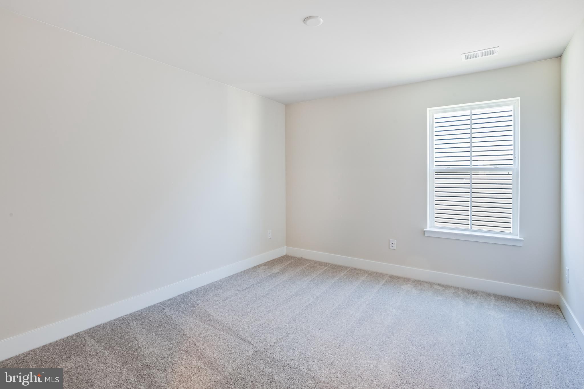 201 Mariners Circle Milton, DE 19968 - Photo 21 of 39 an empty room with a window