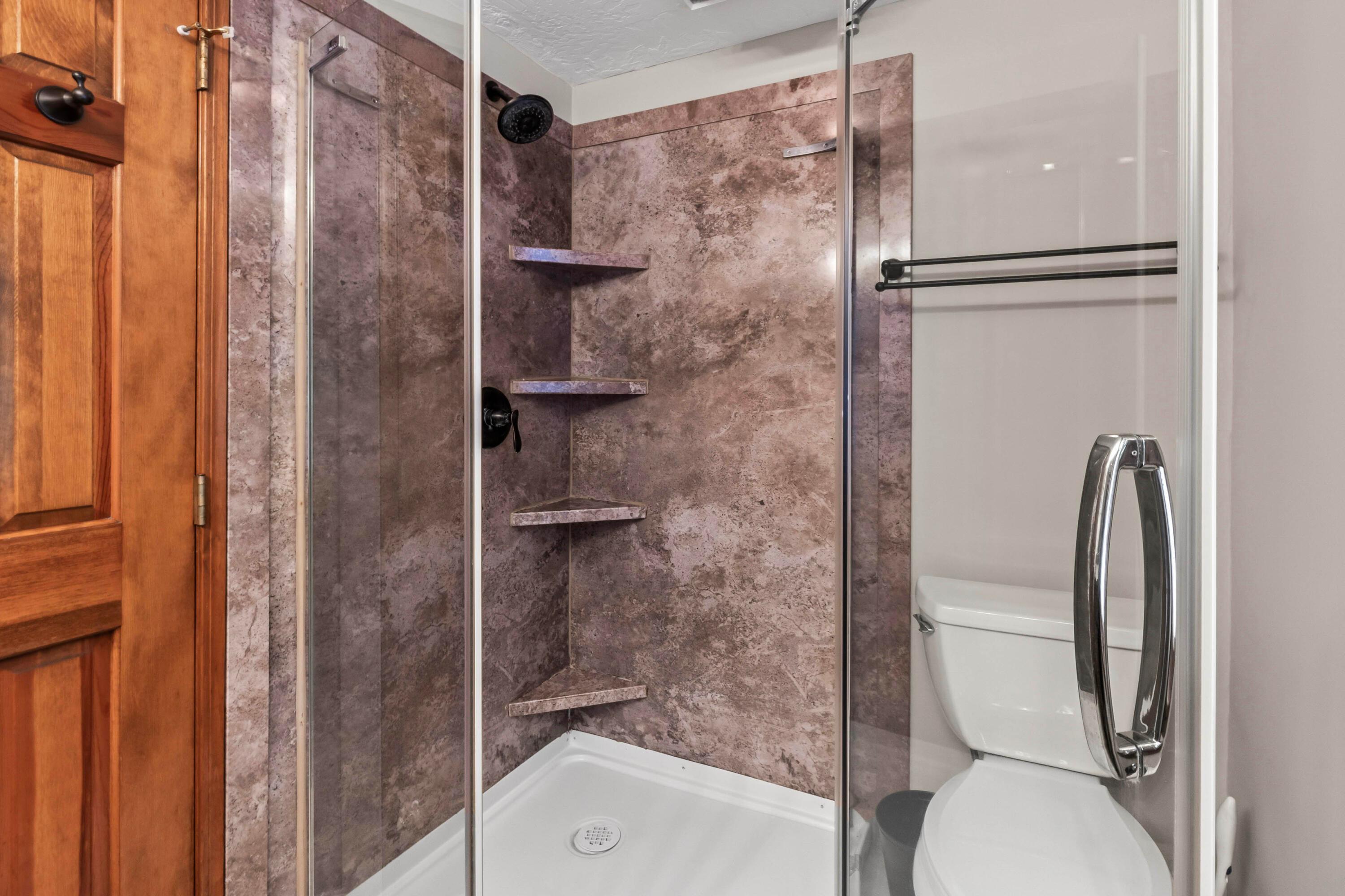 6940 Graham Road Mount Vernon, OH 43050 - Photo 10 of 70 • Grouted vinyl
flooring
• Ivory painted walls
• Enclosed vanity with
double bowl, granite
sinktop
• 6 bulb wall light
• (2) mirrored medicine
cabinets
• Shower stall with glass
enclosure & fiberglass surround
• Lighted ceiling exhaust