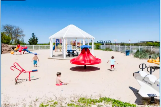 an aerial view of residential building and ocean