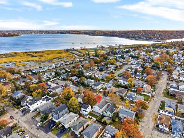 an aerial view of residential houses with outdoor space