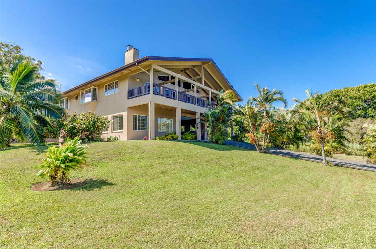 238 South Holokai Road Haiku, HI 96708 - Photo 1 of 28 a front view of a house with a yard