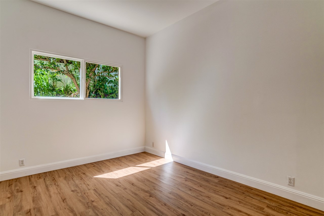 238 South Holokai Road Haiku, HI 96708 - Photo 24 of 28 a view of an empty room with wooden floor and a window